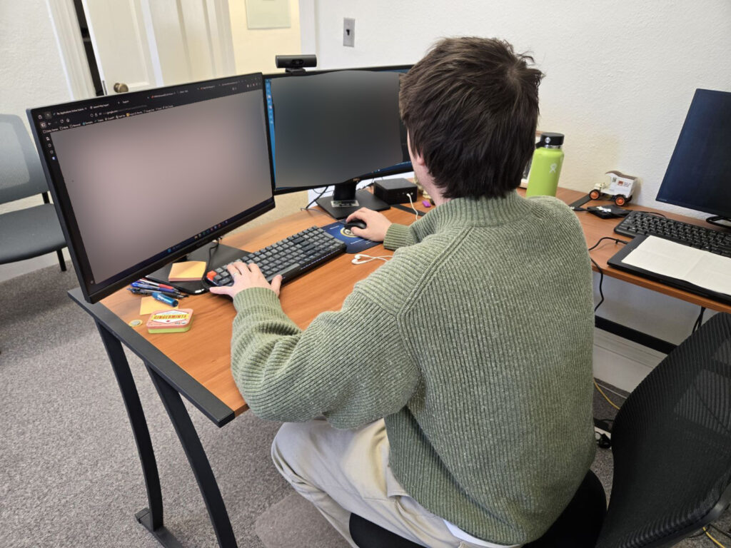 CourseVector technician working at desk