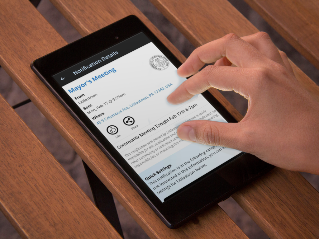 savvy citizen alert on tablet sitting on a wooden table