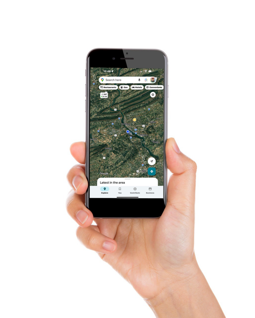 hand holding a cell phone with local search results